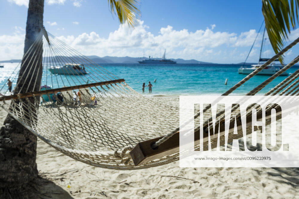 Empty hammock at beach against sky during sunny day, British Virgin Islands RUNF03197