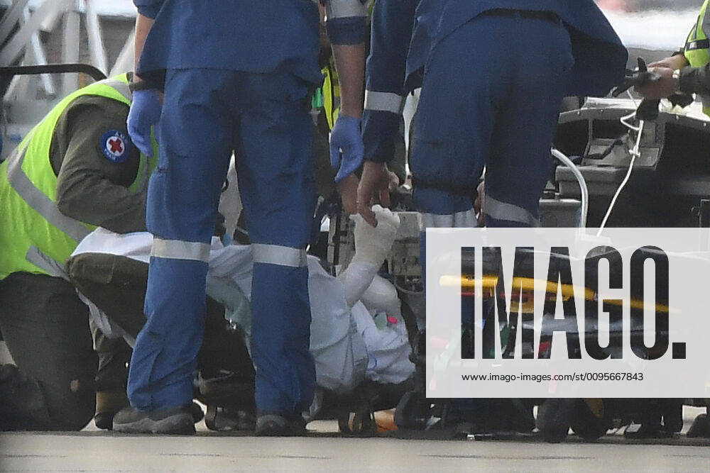 NZ VOLCANO SURVIVORS RETURN, A survivor of the fatal Whaakaari Volcanic eruption in New Zealand is removed on a stretcher from a RAAF C-130 Hercules at Sydney Airport in Sydney, Thursday, December 12, 2019. ( NO ARCHIVING, , NO USE IN BOOKS WITHOUT CONSENT SYDNEY NSW AUSTRALIA
