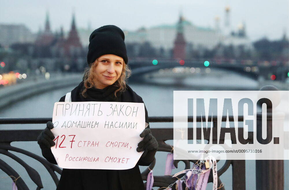 Maria Alyokhina, a member of the Russian punk rock group Pussy Riot, co-founder of the MediaZona media outlet, stages a one-person protest during an event titled Bridge of Sisters in support of the Khachaturyan Sisters, charged with the murder of their father, on the Patriarshy Bridge. Activists have handed out ribbons and hung locks reading Freedom to Khachaturyan Sisters on the bridge. Sergei Fadeichev TASS TS0C74F9