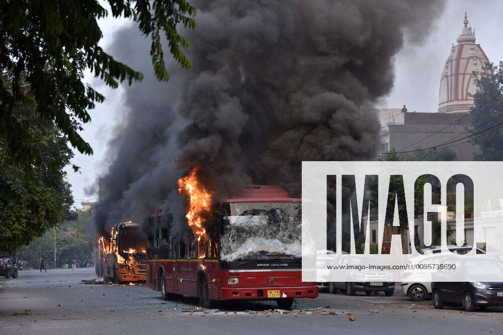 A burning bus is seen after it was set on fire by demonstrators during a protest against a the Citizenship Amendment Act, at New Friends Colony on December 15, 2019 in New Delhi, India. Protestors torched four public buses and two police vehicles as they clashed with police in New Friends Colony near Jamia Millia Islamia during a demonstration against the amended Citizenship Act on Sunday, leaving nearly 60 people including students, cops and fire fighters injured. (Photo by Sanjeev Verma Hindustan Times) Buses Torched, Nearly 60 Injured During Protest Against Citizenship Law Near Jamia University