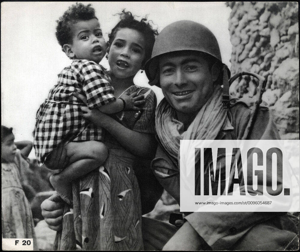 ALGERIAN WAR French soldier with Algerian children Anonymous photograph around 1958 for French propaganda Credit Collection IM Kharbine Tapabor KH202444