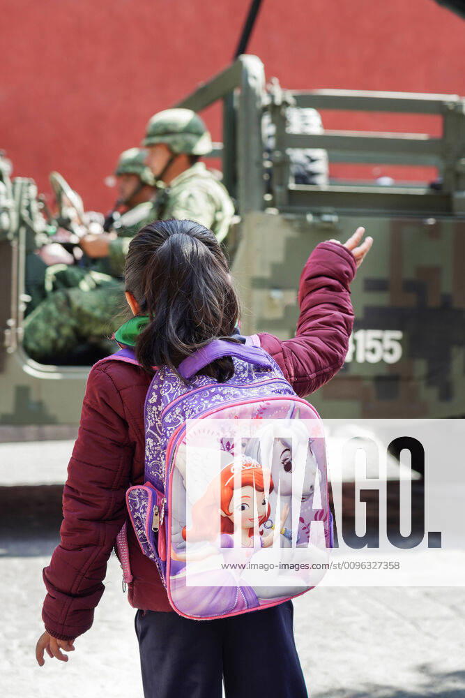 San Miguel De Allende, Guanajuato, Mexico: A young girl wearing a princess backpack waves to Mexican Soldiers during a parade to celebrate the 251st birthday of the Mexican Independence hero Ignacio Allende January 21, 2020 in San Miguel de Allende, Guanajuato, Mexico. Allende, from a wealthy family in San Miguel played a major role in the independency war against Spain in 1810 and later honored by his home city by adding his name. San Miguel De Allende Mexico - ZUMAe02_ 20200121_zaf_e02_019