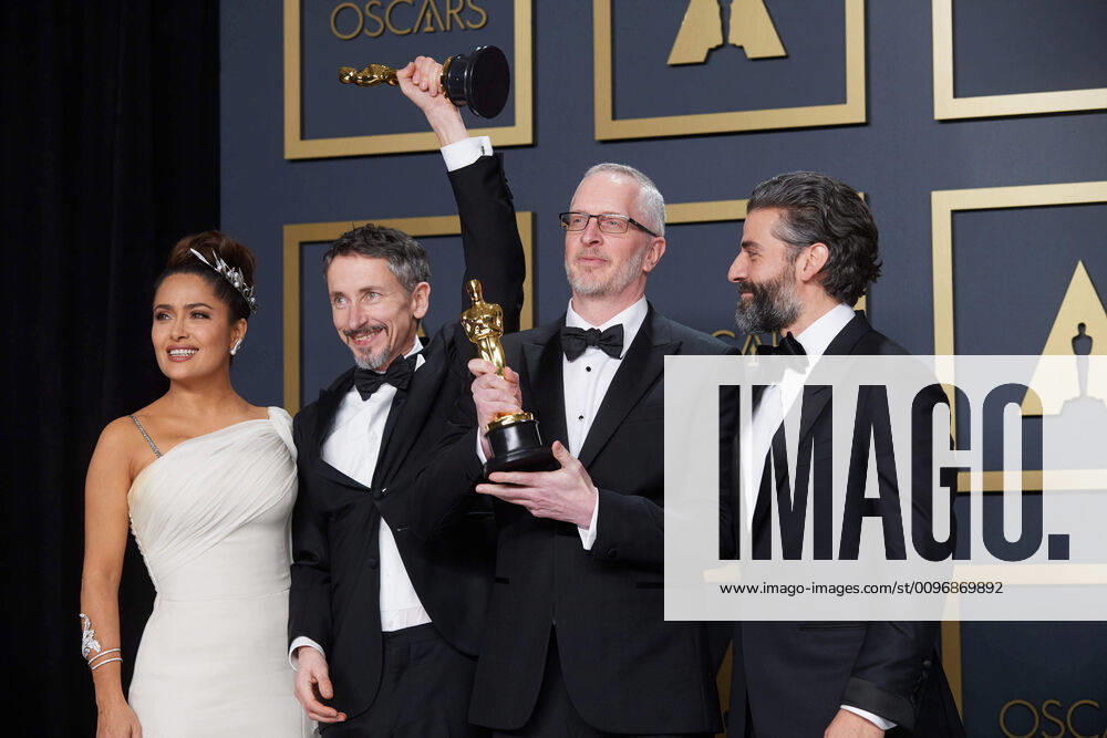 Salma Hayek, Stuart Wilson, Mark Taylor, Oscar Isaac pose backstage with the Oscar for Sound Mixing during the live ABC Telecast of The 92nd Oscars at the Dolby Theatre in Hollywood, CA on Sunday, February 9, 2020. Los Angeles CA USA