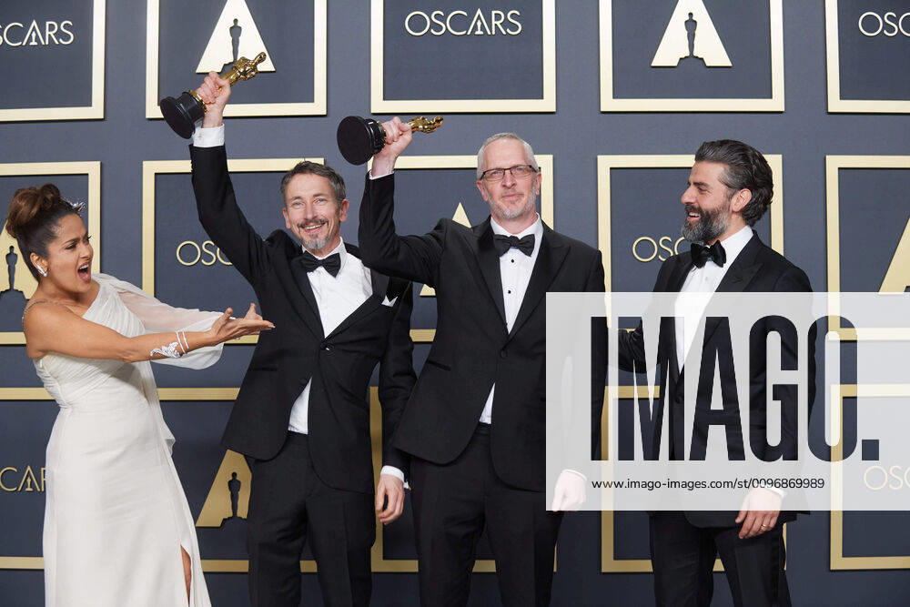 Salma Hayek, Stuart Wilson, Mark Taylor, Oscar Isaac pose backstage with the Oscar for Sound Mixing during the live ABC Telecast of The 92nd Oscars at the Dolby Theatre in Hollywood, CA on Sunday, February 9, 2020. Los Angeles CA USA