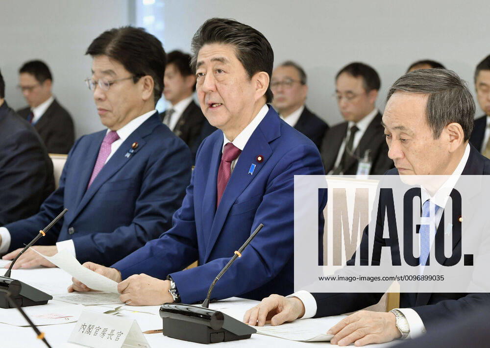 New coronavirus Japanese Prime Minister Shinzo Abe (C) attends a Feb. 12, 2020 meeting in Tokyo of the task force dealing with the coronavirus outbreak.