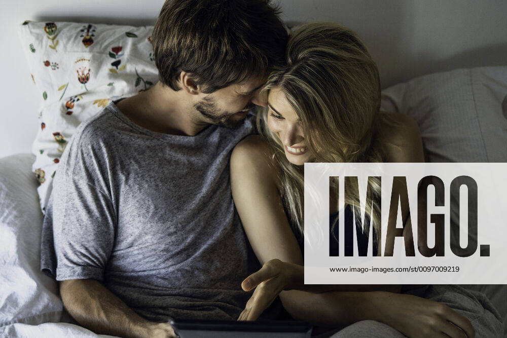Couple watching movie on digital tablet