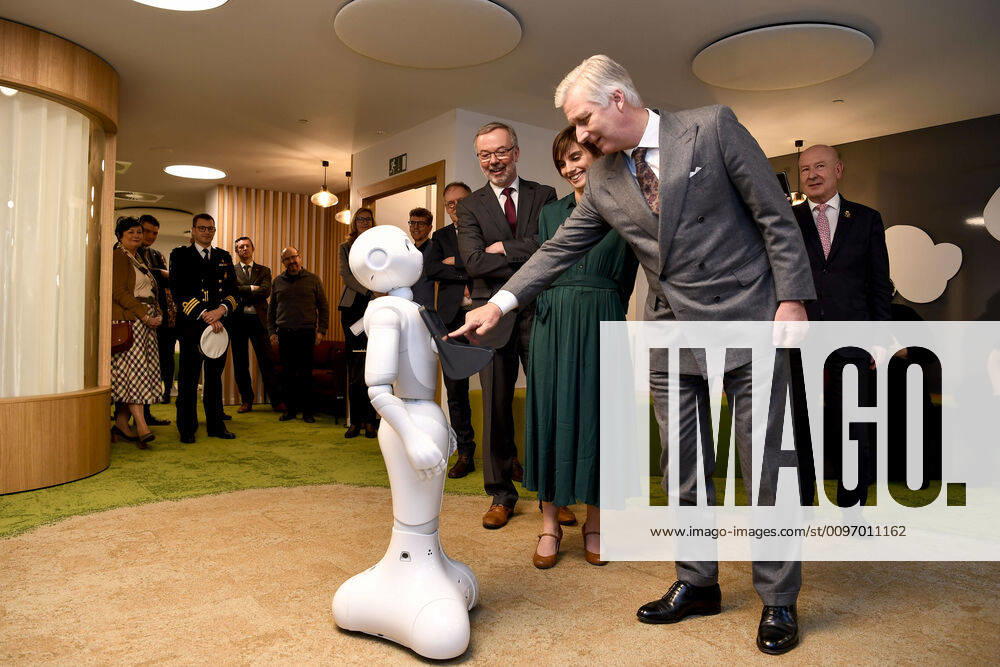 RSZ-ONSS administrator-general Koen Snyders and King Philippe - Filip of Belgium touches the screen of a humanoid robot during a visit of Belgian king to the Rijksdienst voor Sociale Zekerheid - Office national de securite sociale - National Social Security Office at the occasion of the 75th anniversary of the institution, in Brussels, Tuesday 18 February 2020. DIRKxWAEM 2476425