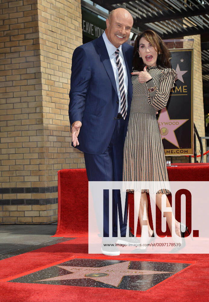 Dr. Phil McGraw (L) and his wife Robin McGraw attend the star unveiling ceremony honoring him with the 2,688th star on the Hollywood Walk of Fame in Los Angeles, California on February 21, 2020. LAP202002213001 CHRISxCHEW
