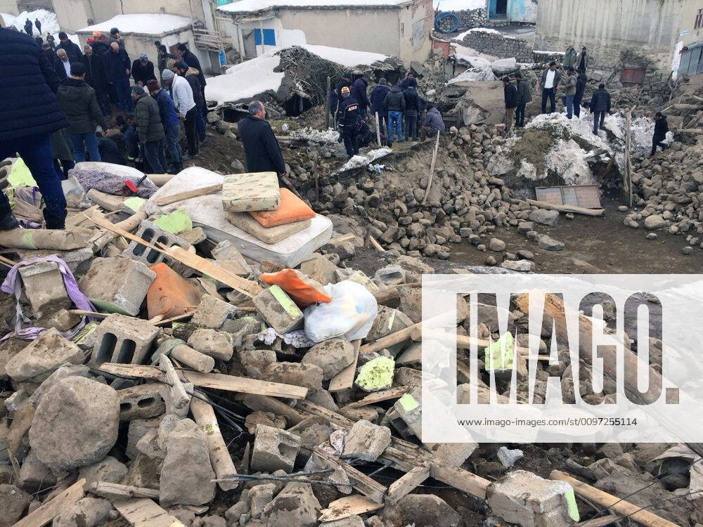 (200223) -- VAN (TURKEY), Feb. 23, 2020 (Xinhua) -- People stand on debris in the wake of an earthquake in Van Province, Turkey, on Feb. 23, 2020. Nine people were killed on Sunday in eastern Turkey s Van Province after an earthquake hit neighboring Iran. An earthquake of magnitude 5.7 struck West Azerbaijan Province in northwestern Iran on Sunday, hitting Turkish-Iranian border as well. (Str Xinhua) TURKEY-VAN-EARTHQUAKE-IRAN-BORDER
