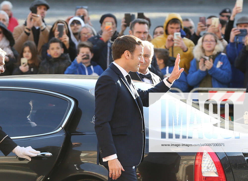 French President Emmanuel Macron waves to people as arriving at the Royal Palace, venue of the XXXV Italian-French Summit
