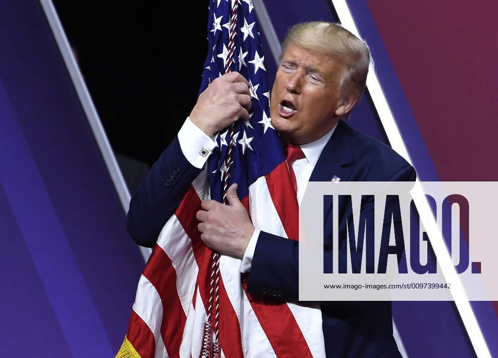 President Donald Trump embraces the American flag as he concludes remarks at the Conservative Political Action Conference (CPAC), Saturday, February 29, 2020, in National Harbor, Maryland. Thousands of conservative activists, elected officials and pundits gathered to hear speakers on the theme America vs. Socialism . WAP20200229514 MIKExTHEILER
