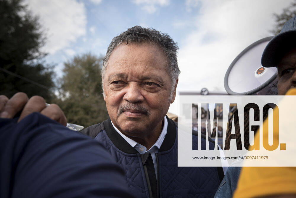 Celebrating the 55th anniversary of the à Bloody Sunday civil rights march across the Edmund Pettus Bridge..Pictured: Civil rights legend Jesse Jackson holds onto should of a security guard to keep from falling as he greets marchers outside Brown AME chapel. Selma USA - ZUMAn03_ 20200301_zaf_n03_027