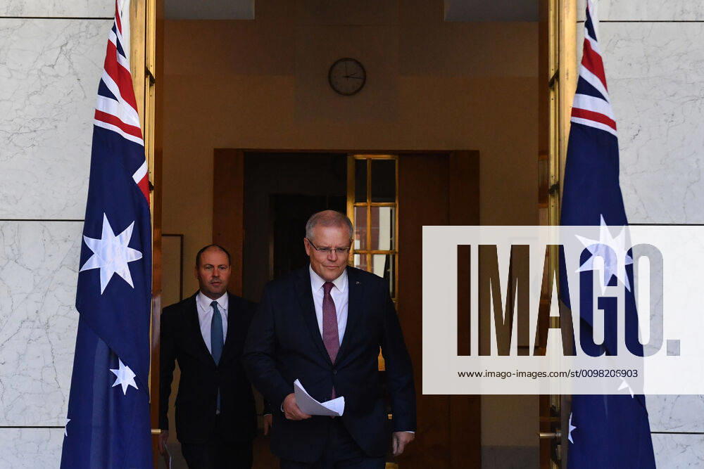 SCOTT MORRISON CORONAVIRUS UPDATE, Treasurer Josh Frydenberg and Prime Minister Scott Morrison arrive at a press conference to give a coronavirus update at Parliament House in Canberra, Friday, March 20, 2020. ( NO ARCHIVING, , NO USE IN BOOKS WITHOUT CONSENT Canberra ACT AUSTRALIA