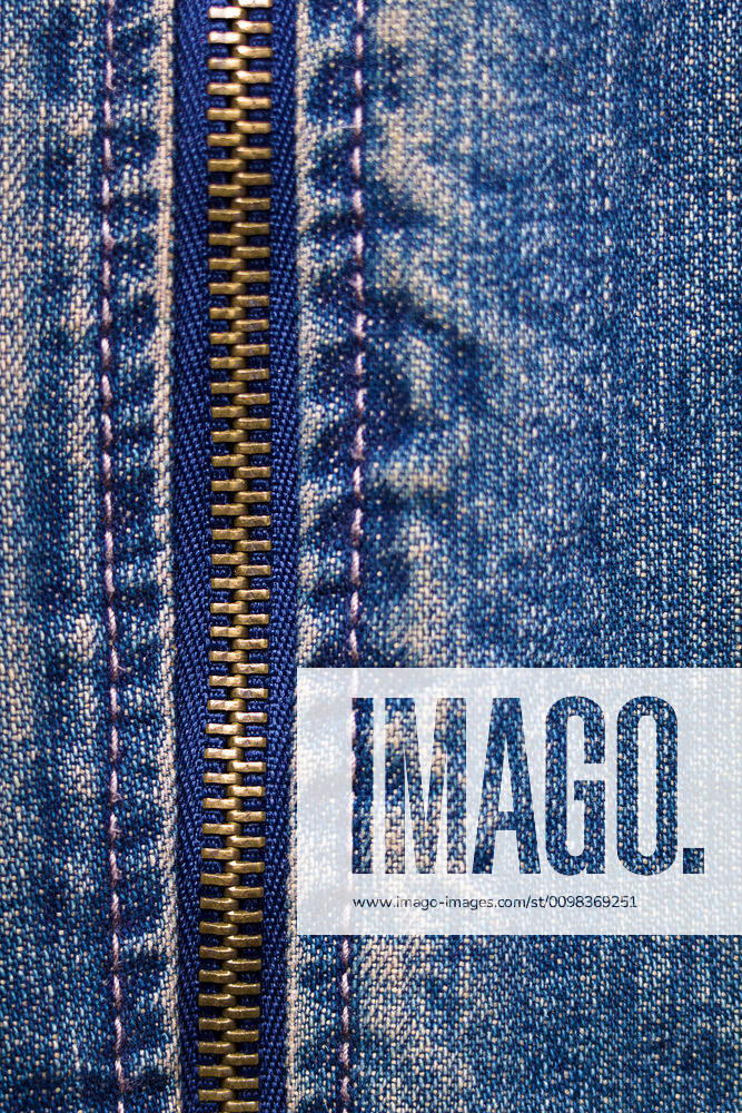 Metal zipper with denim metal zipper with denim. close up. macro