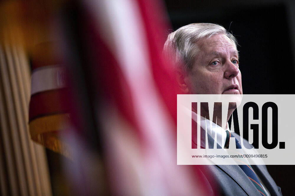 United States Senator Lindsey Graham (Republican of South Carolina) listens during a news conference with United States Senator Tim Scott (Republican of South Carolina), United States Senator Rick Scott (Republican of Florida), and United States Senator Ben Sasse (Republican of Nebraska) at the United States Capitol in Washington D.C., U.S. on Wednesday, March 25, 2020. The Senators are calling for a correction to a supposed drafting error in the Coronavirus Stimulus Package that the Senate was set to vote on today, stating it incentivizes unemployment.