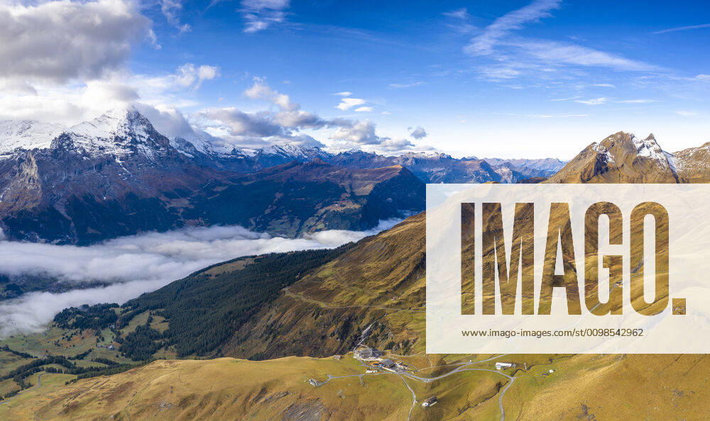 Aerial panoramic of Eiger and sea of clouds surrounding First and Grindelwald in autumn, Bernese Alps, Canton of Bern, Switzerland, Europe
