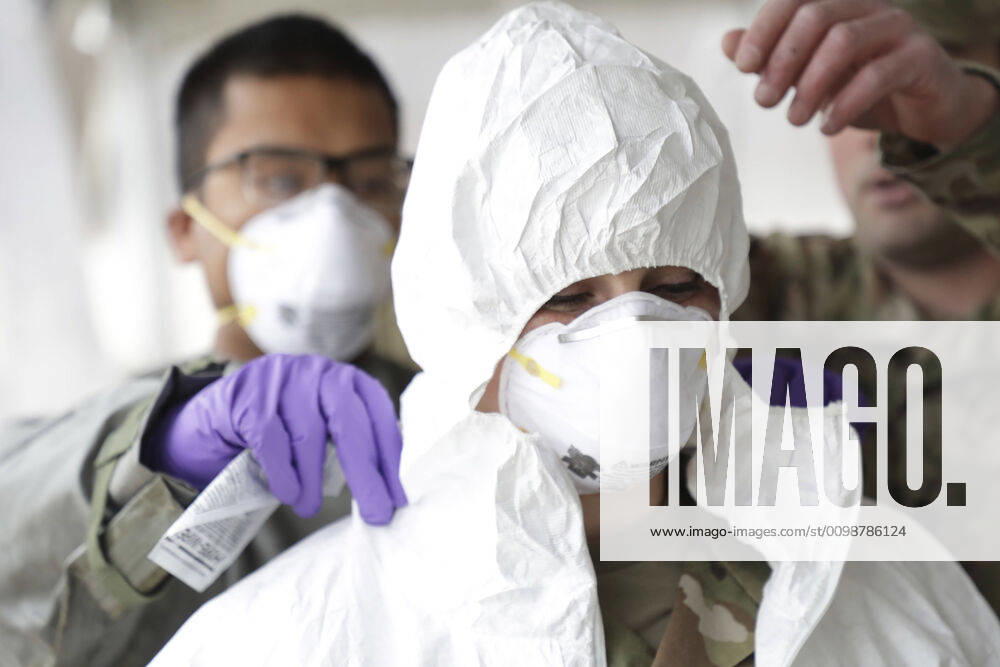 U.S. Army Sgt. Cora Brown is trained in proper use of protective gear before assisting with COVID-19, coronavirus pandemic testing at Community College of Rhode Island March 30, 2020 in Warwick, Rhode Island. Warwick United States of America - ZUMAp138 20200330_zaa_p138_020