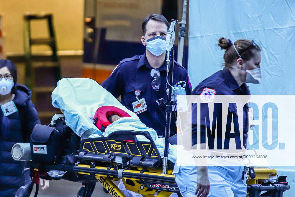 Health professionals transported by ambulance a baby with an oxygen cylinder attached to a stretcher in New York during the Covid-19 coronavirus pandemic in the United States. New York USA - ZUMAc233 20200408_zsp_c233_098