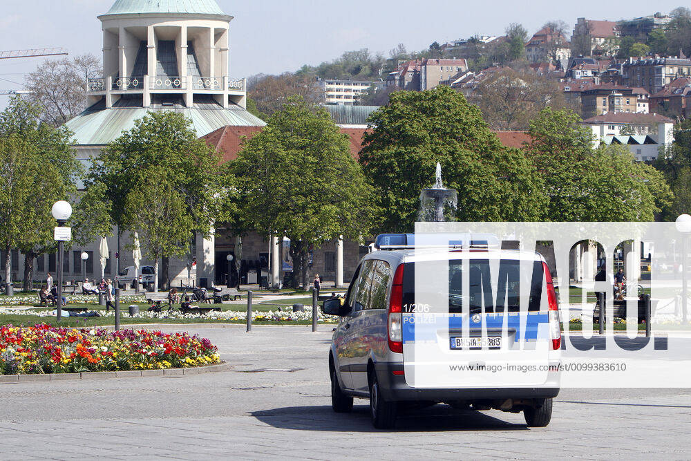 A police patrol of the Baden Württemberg state police checks the compliance with the contact prohibitions and minimum distances on the shopping street and pedestrian zone Königstraße at Schlossplatz in the city centre of Stuttgart, Baden Württemberg, Bavaria, Germany