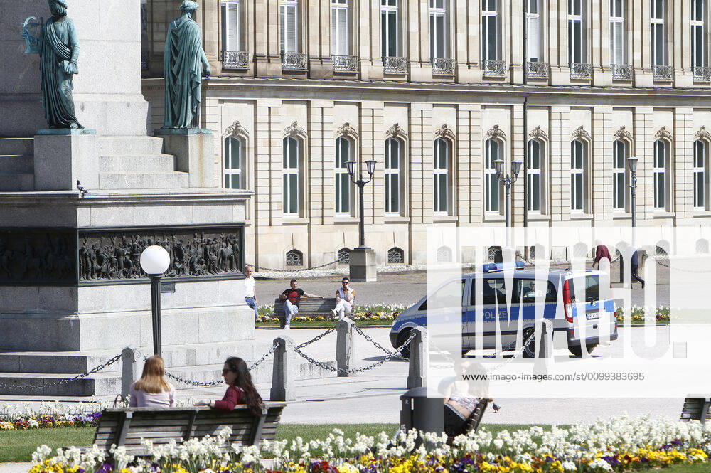 A police patrol of the Baden Württemberg State Police checks the compliance with the contact prohibitions and minimum distances at the Schlossplatz in the city centre of Stuttgart, Baden Württemberg, Bavaria, Germany