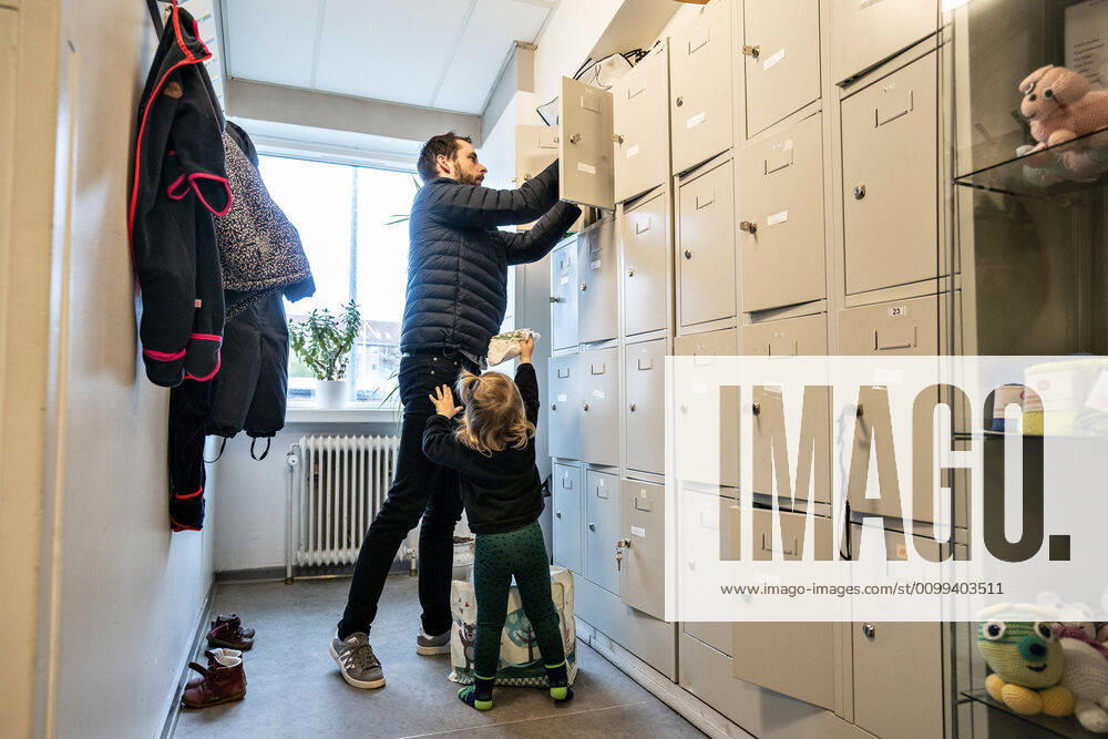 The nursery DUI in Aalborg opens again for the institutions children, Wednesday morning, April 15, 2020 Here Solvej has arrived with his father Because of the corona crisis, the nursery has been closed, and after the nursery has been changed inside and outside, the children and the adult educators can keep away and wash hands, Aalborg Jutland Denmark,