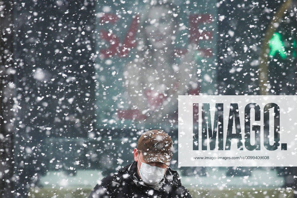 A man seen in a street during a snowfall. Since 30 March 2020, Moscow has been on lockdown. Earlier, the Russian government announced a paid period off work for employed people and school holidays, which are expected to last till the end of April. As of 15 April 2020, Russia has reported more 24,500 confirmed cases of the novel coronavirus infection, with more than 14,800 confirmed cases in Moscow. Sergei Fadeichev TASS TS0D5E4C