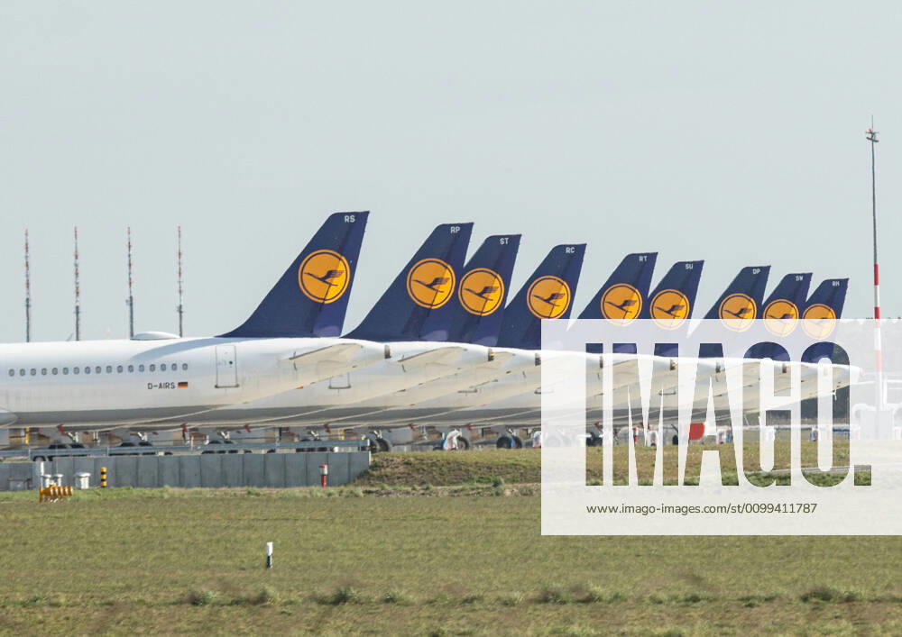 Lufthansa parks planes at BER airport, Due to the corona virus, worldwide demand for flights has fallen sharply, more and more flights are being cancelled Lufthansa planes with the crane logo are parked at BER airport The turbines and tyres have been covered to protect them Schoenefeld Brandenburg Germany
