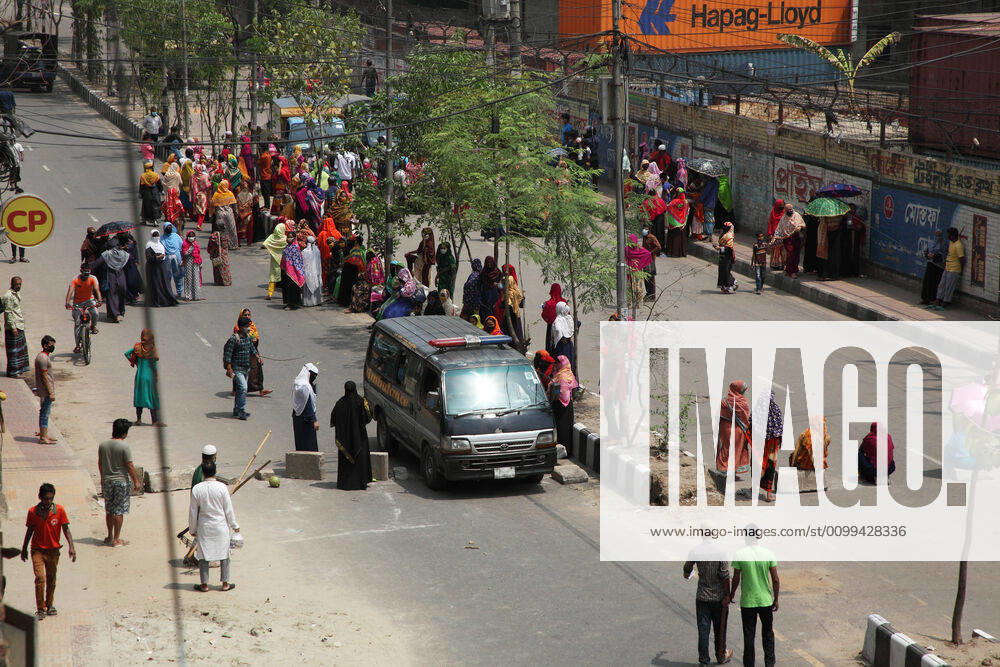 An ambulance carrying a patient by breaking the barrier of movement, while female garment workers demonstrate to demand for due wages in front of their factory in South Kamlapur, Dhaka, Bangladesh; during the nationwide lockdown of the coronavirus (Covid-19) pandemic. Their garment factory had been closed for a period of time since 25, March2020 for their health issue due to the coronavirus pandemic. - ZUMAa186 20200416_zip_a186_002