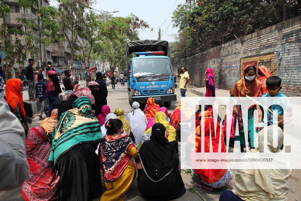 Female garment workers halt a police truck by sitting on road and they do not allow to go, while they demonstrate to demand for due wages in front of their factory in South Kamlapur, Dhaka, Bangladesh; during the nationwide lockdown of the coronavirus (Covid-19) pandemic. Their garment factory had been closed for a period of time since 25, March2020 for their health issue due to the coronavirus pandemic. - ZUMAa186 20200416_zip_a186_003
