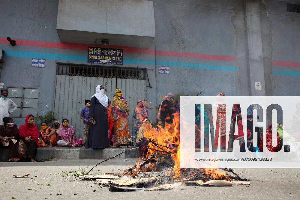 By setting fire on road, female garment workers are demonstrating to demand for due wages in front of their factory gate in South Kamlapur, Dhaka, Bangladesh; during the nationwide lockdown of the coronavirus (Covid-19) pandemic. Their garment factory had been closed for a period of time since 25, March2020 for their health issue due to the coronavirus pandemic. - ZUMAa186 20200416_zip_a186_004