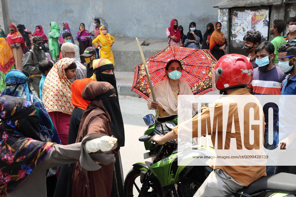 Female garment workers halt a motorcycle rider and they do not allow him to go, while they demonstrate to demand for due wages in front of their factory in South Kamlapur, Dhaka, Bangladesh; during the nationwide lockdown of the coronavirus (Covid-19) pandemic. Their garment factory had been closed for a period of time since 25, March2020 for their health issue due to the coronavirus pandemic. - ZUMAa186 20200416_zip_a186_005