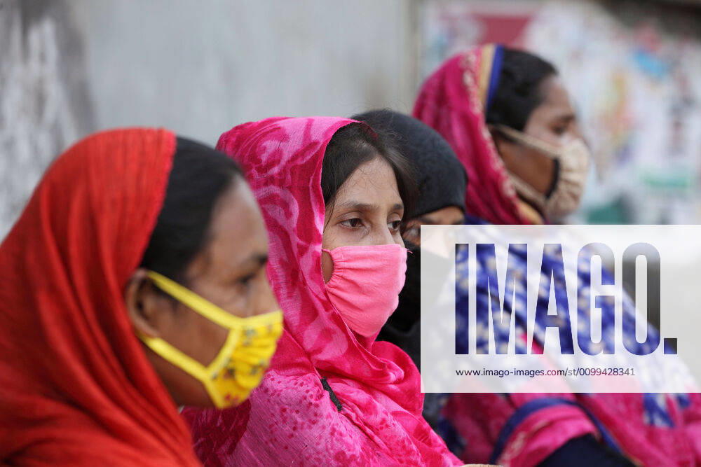 Worried female garment workers are sitting on footpath in front of their factory gate, while they demonstrate to demand for due wages in South Kamlapur, Dhaka, Bangladesh; during the nationwide lockdown of the coronavirus (Covid-19) pandemic. Their garment factory had been closed for a period of time since 25, March2020 for their health issue due to the coronavirus pandemic. - ZUMAa186 20200416_zip_a186_007