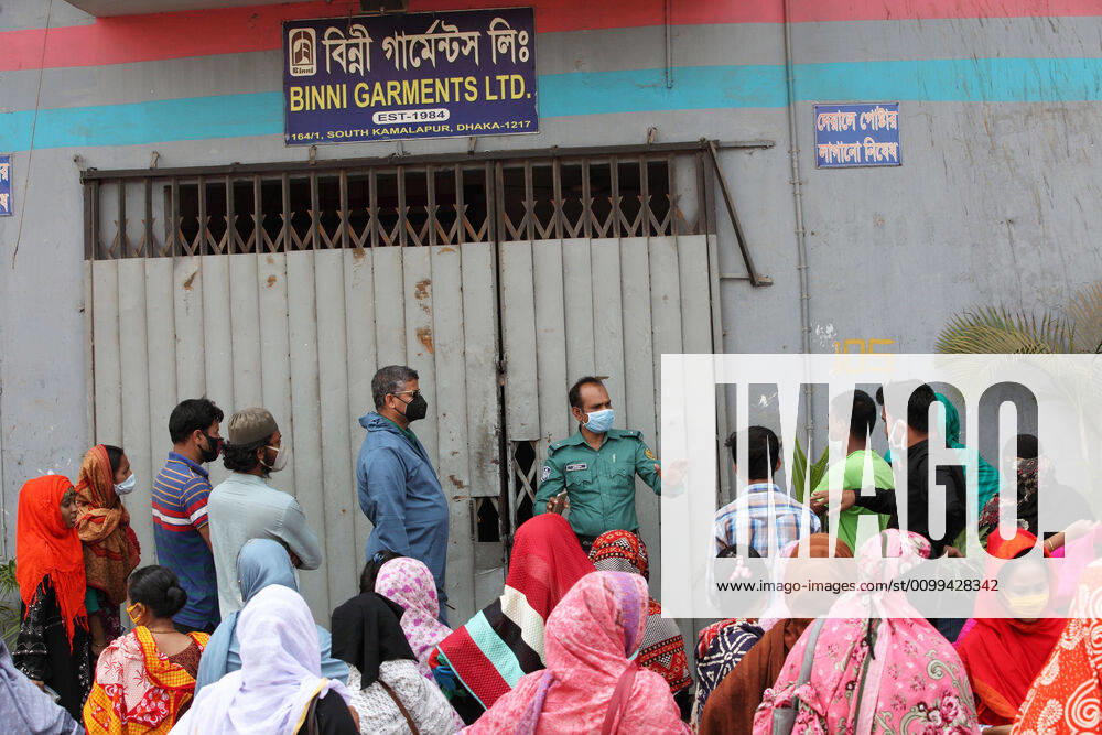 A police officer talk to the garment workers to solve the problem in front of their factory gate, while they demonstrate to demand for due wages in South Kamlapur, Dhaka, Bangladesh; during the nationwide lockdown of the coronavirus (Covid-19) pandemic. Their garment factory had been closed for a period of time since 25, March2020 for their health issue due to the coronavirus pandemic. - ZUMAa186 20200416_zip_a186_008