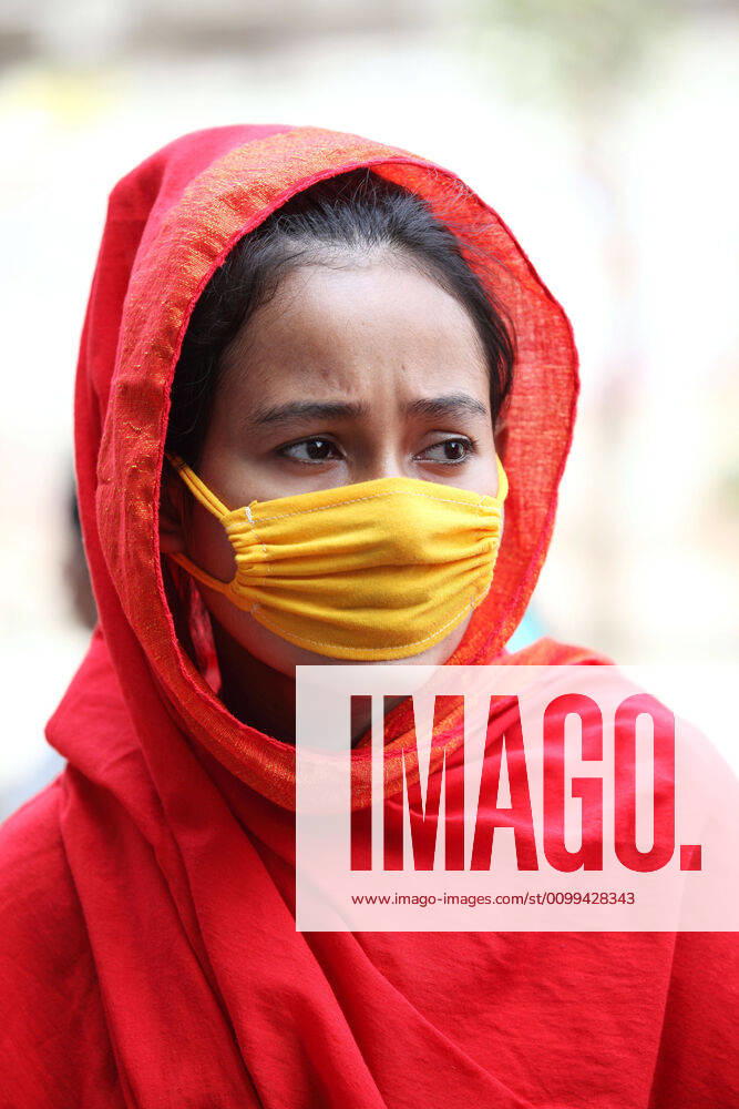 A worried female garment worker is standing on road in front of their factory, while she also demonstrates along to others to demand for due wages in South Kamlapur, Dhaka, Bangladesh; during the nationwide lockdown of the coronavirus (Covid-19) pandemic. Their garment factory had been closed for a period of time since 25, March2020 for their health issue due to the coronavirus pandemic. - ZUMAa186 20200416_zip_a186_009
