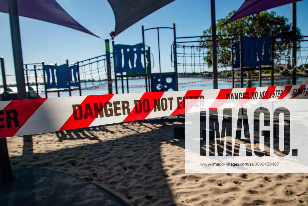 A playground closed with tape saying Danger Do Not Enter during Coronavirus crisis..Australian states including Queensland take strict new lockdown rules to stop the spread of Covid-19. Queensland Australia - ZUMAs197 20200416_zaa_s197_006