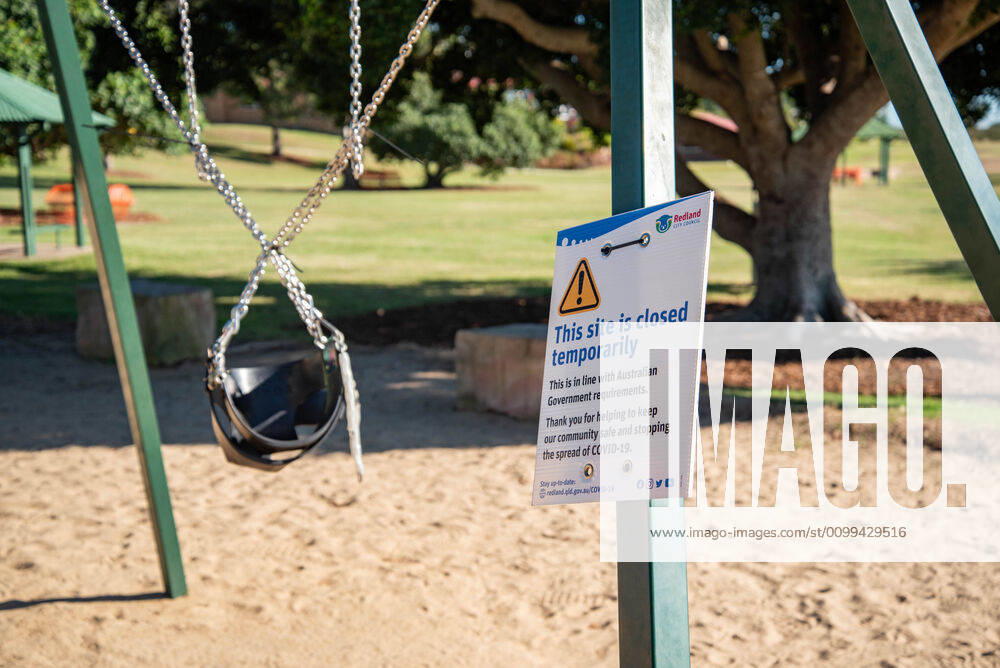 A sling chair closed with a sign saying This Site is Closed Temporarily during Coronavirus crisis..Australian states including Queensland take strict new lockdown rules to stop the spread of Covid-19. Queensland Australia - ZUMAs197 20200416_zaa_s197_022