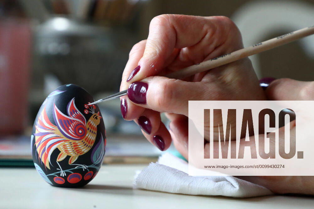 Artist Iya Tokareva paints a wooden Easter egg Gorodets-style at her home studio; Gorodets painting, one of the traditional Russians handicrafts, originated in the middle of XIX century in the town of Gorodets, the Nizhny Novgorod Region. Anton Novoderezhkin TASS TS0D5FDA