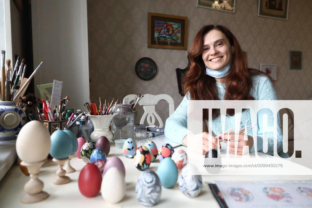 Artist Iya Tokareva paints wooden Easter eggs Gorodets-style at her home studio; Gorodets painting, one of the traditional Russians handicrafts, originated in the middle of XIX century in the town of Gorodets, the Nizhny Novgorod Region. Anton Novoderezhkin TASS TS0D5FDB
