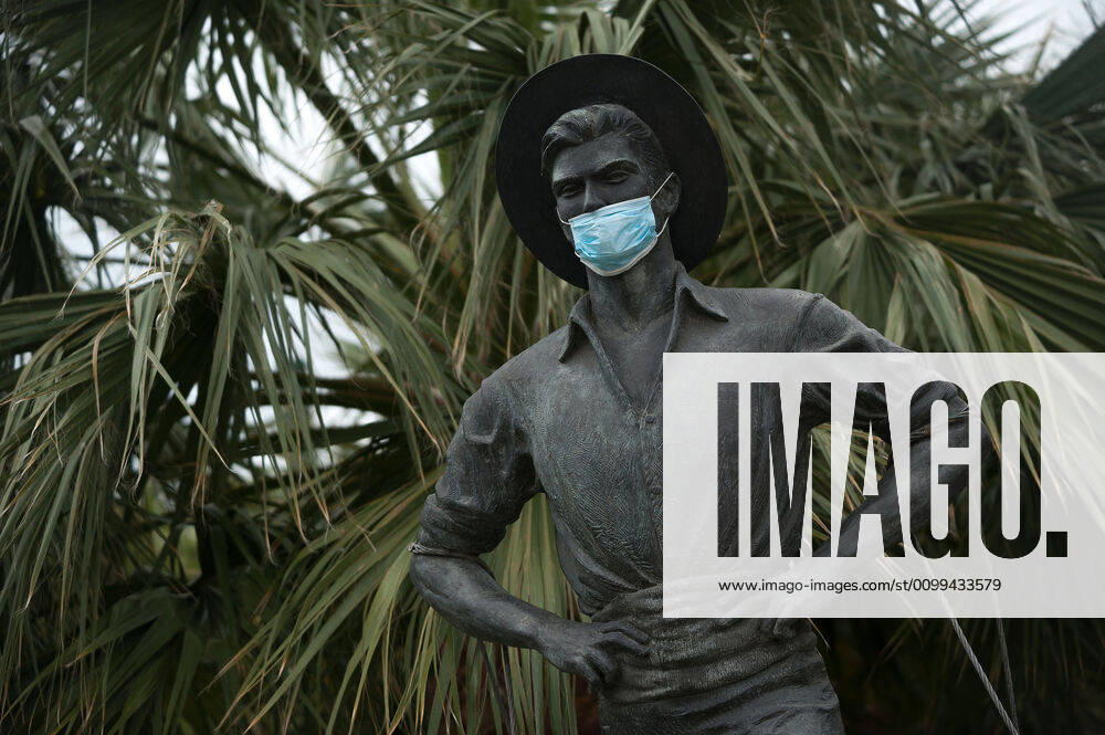 The statue of Cenachero is seen wearing a face mask as a way of raising awareness, during the covid-19 crisis..Following the confinement decreed by the Spanish government and will extended until 10th May, people are confinement in their homes causing an exceptional situation of unusual urban scenes such as empty streets. Malaga Spain - ZUMAs197 20200416_zaa_s197_045