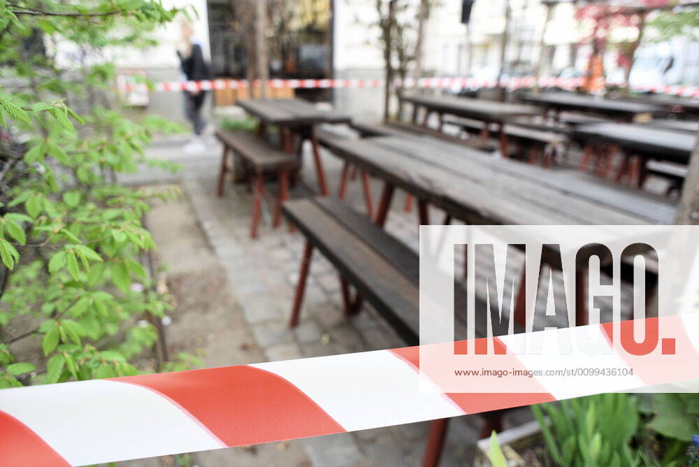 A restaurant in the Kreuzberg Gräfekiez has closed off the outside area with a flutter band so that no one can sit there Restaurant tables closed due to corona