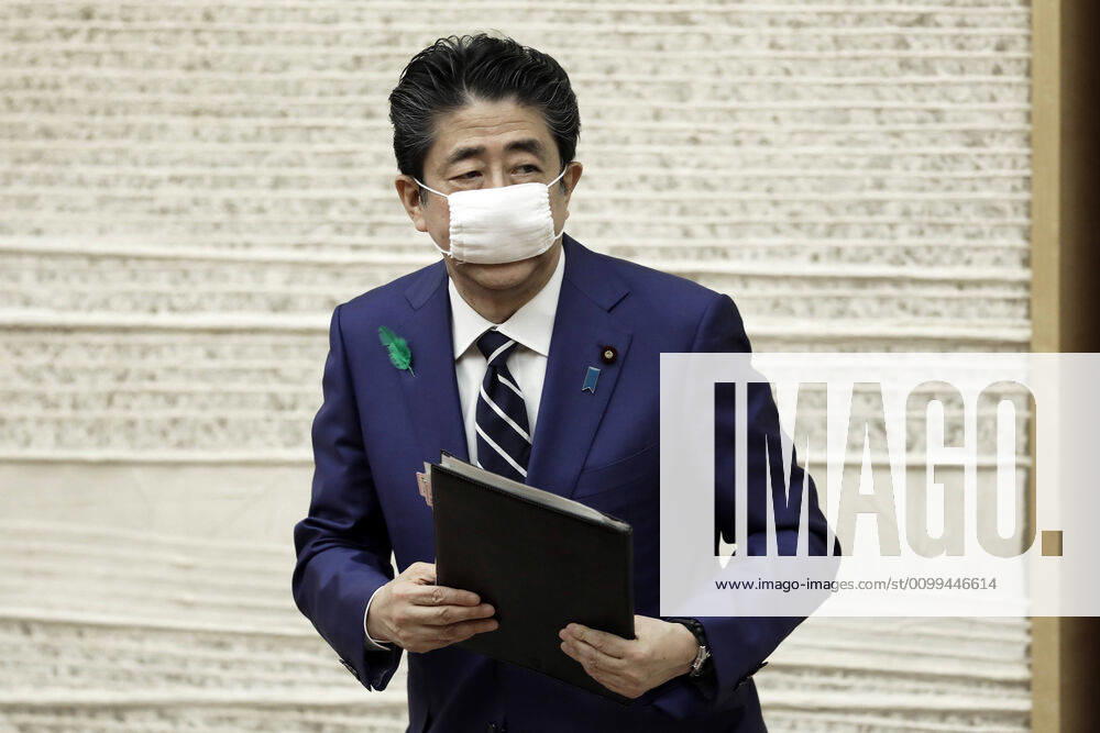 Shinzo Abe, Japan s prime minister, wearing a protective mask, leaves a news conference at the prime minister s official residence in Tokyo, Japan, on Friday, April 17, 2020. Tokyo Japan - ZUMAz114 20200417_zih_z114_005