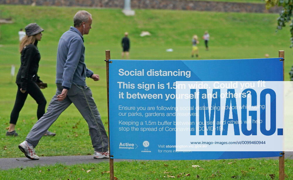 AUSTRALIA CORONAVIRUS COVID-19, People exercise at a park which displays social distancing signage in Melbourne, Saturday, April 18, 2020. Authorities have said social distancing and isolation measures could still remain in place for the next six months. A shutdown of non-essential services is in effect Australia wide in a bid to slow the spread of the coronavirus (COVID-19) disease. ( NO ARCHIVING, , NO USE IN BOOKS WITHOUT CONSENT MELBOURNE VIC AUSTRALIA