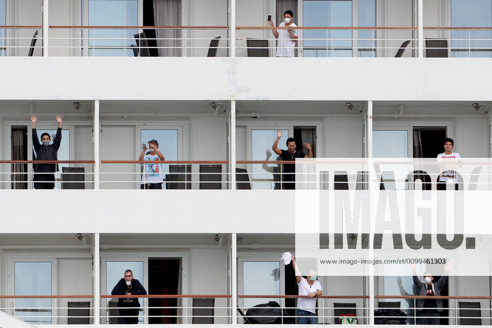 ARTANIA CRUISE SHIP DEPARTURE, Crew members on the cruise ship MV Artania are seen waving goodbye as it departs Fremantle harbour on Saturday, April 18, 2020. The MV Artania arrived in Fremantle over three weeks ago and a reported 79 crew and passengers have tested positive for coronavirus. Two crew members and one passenger have died from the virus.( NO ARCHIVING, , NO USE IN BOOKS WITHOUT CONSENT PERTH WA AUSTRALIA