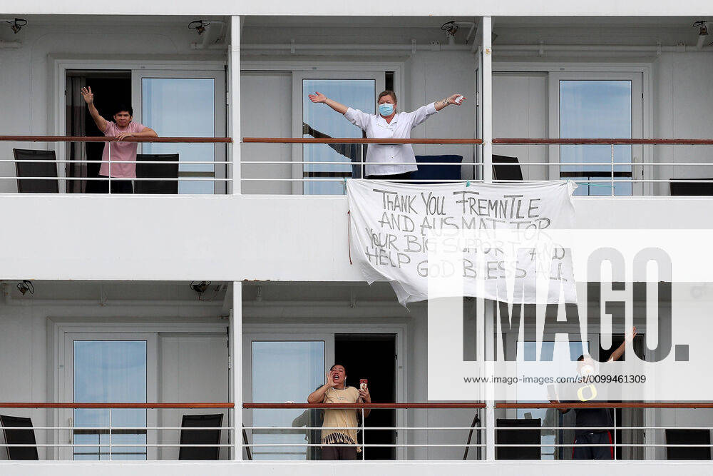 ARTANIA CRUISE SHIP DEPARTURE, Crew members on the cruise ship MV Artania are seen with a sign thanking Fremantle and Australian Medical Assistance Teams (AUSMAT) staff as it departs Fremantle harbour on Saturday, April 18, 2020. The MV Artania arrived in Fremantle over three weeks ago and a reported 79 crew and passengers have tested positive for coronavirus. Two crew members and one passenger have died from the virus.( NO ARCHIVING, , NO USE IN BOOKS WITHOUT CONSENT PERTH WA AUSTRALIA