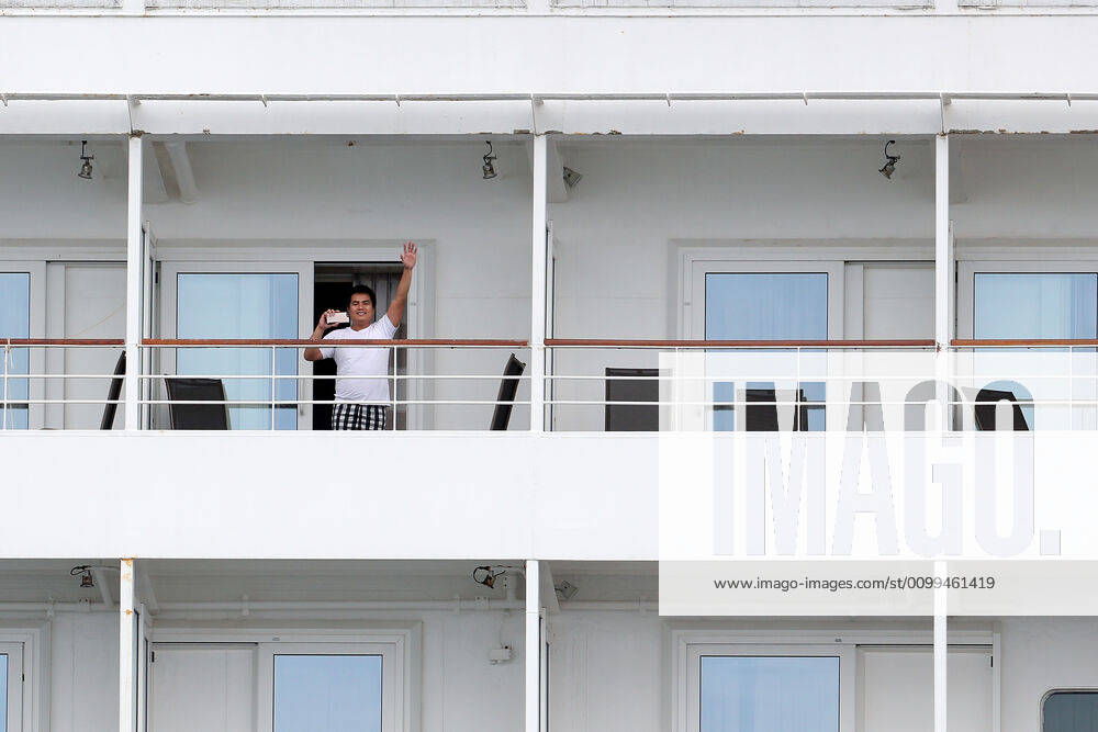 ARTANIA CRUISE SHIP DEPARTURE, A crew member on the cruise ship MV Artania is seen waving goodbye as it departs Fremantle harbour on Saturday, April 18, 2020. The MV Artania arrived in Fremantle over three weeks ago and a reported 79 crew and passengers have tested positive for coronavirus. Two crew members and one passenger have died from the virus.( NO ARCHIVING, , NO USE IN BOOKS WITHOUT CONSENT PERTH WA AUSTRALIA