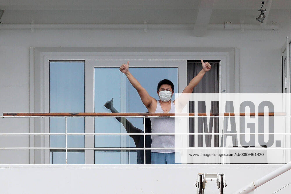 ARTANIA CRUISE SHIP DEPARTURE, A crew member on the cruise ship MV Artania is seen waving goodbye as it departs Fremantle harbour on Saturday, April 18, 2020. The MV Artania arrived in Fremantle over three weeks ago and a reported 79 crew and passengers have tested positive for coronavirus. Two crew members and one passenger have died from the virus.( NO ARCHIVING, , NO USE IN BOOKS WITHOUT CONSENT PERTH WA AUSTRALIA