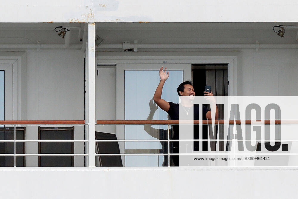 ARTANIA CRUISE SHIP DEPARTURE, A crew member on the cruise ship MV Artania is seen waving goodbye as it departs Fremantle harbour on Saturday, April 18, 2020. The MV Artania arrived in Fremantle over three weeks ago and a reported 79 crew and passengers have tested positive for coronavirus. Two crew members and one passenger have died from the virus.( NO ARCHIVING, , NO USE IN BOOKS WITHOUT CONSENT PERTH WA AUSTRALIA
