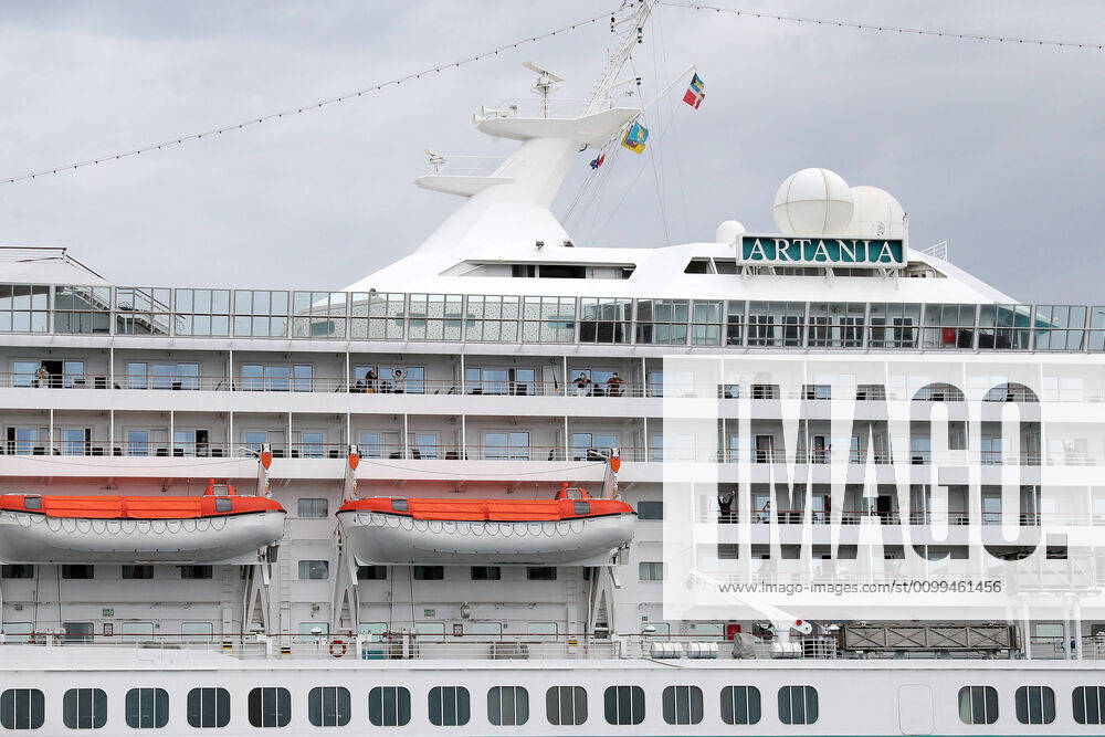 ARTANIA CRUISE SHIP DEPARTURE, Crew members on the cruise ship MV Artania are seen waving goodbye as it departs Fremantle harbour on Saturday, April 18, 2020. The MV Artania arrived in Fremantle over three weeks ago and a reported 79 crew and passengers have tested positive for coronavirus. Two crew members and one passenger have died from the virus.( NO ARCHIVING, , NO USE IN BOOKS WITHOUT CONSENT PERTH WA AUSTRALIA