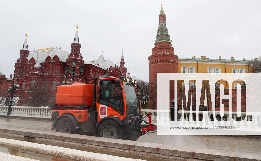 A utility machine disinfecting the pavement of Manezhnaya Street with a special solution recommended by the Russian Federal Service for Surveillance on Consumer Rights Protection and Human Wellbeing (Rospotrebnadzor) amid the COVID-19 coronavirus pandemic. Alexander Shcherbak TASS TS0D6305