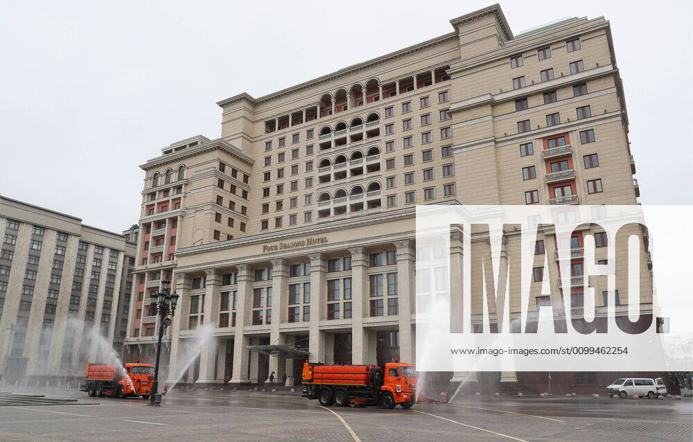 Utility machines disinfecting the pavement of Okhotny Ryad Street with a special solution recommended by the Russian Federal Service for Surveillance on Consumer Rights Protection and Human Wellbeing (Rospotrebnadzor) amid the COVID-19 coronavirus pandemic. Alexander Shcherbak TASS TS0D630B